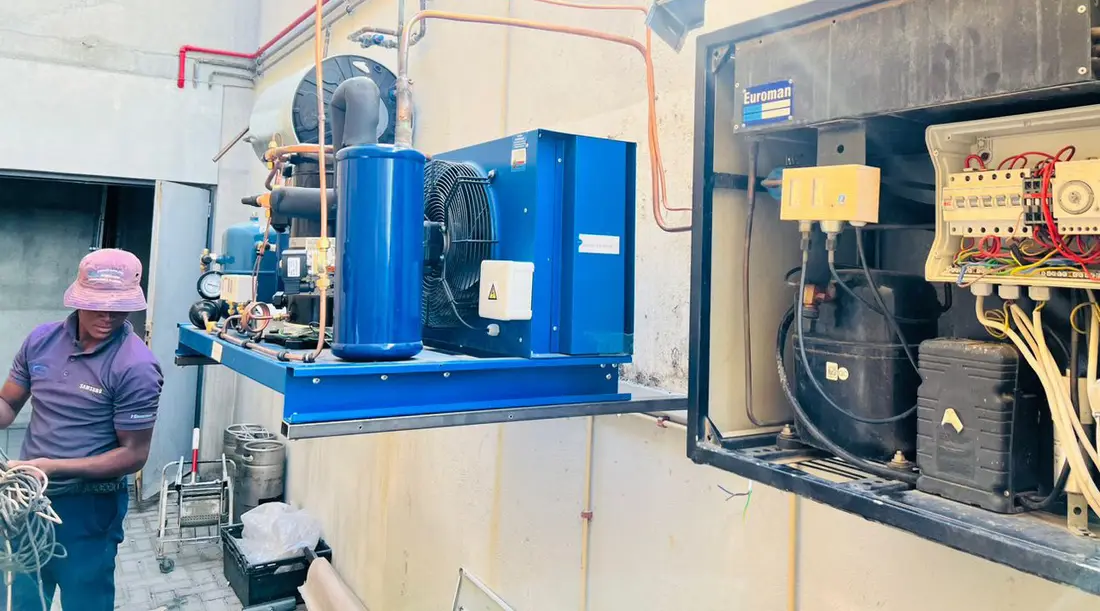 Real site photo: Condensing unit on an industrial freezer room