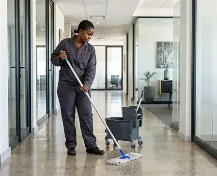 Illustration: Cleaner mopping an office floor